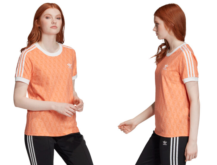 Ropa y moda cómoda para mujeres; chica pelirroja usando playera casual estampada color anaranjada de Adidas, pants negros