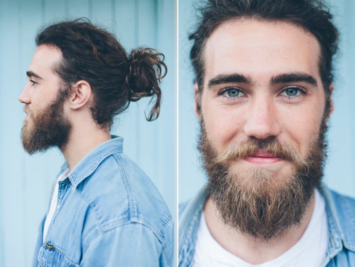 Hombre con ojos azules, barba y chonguito 