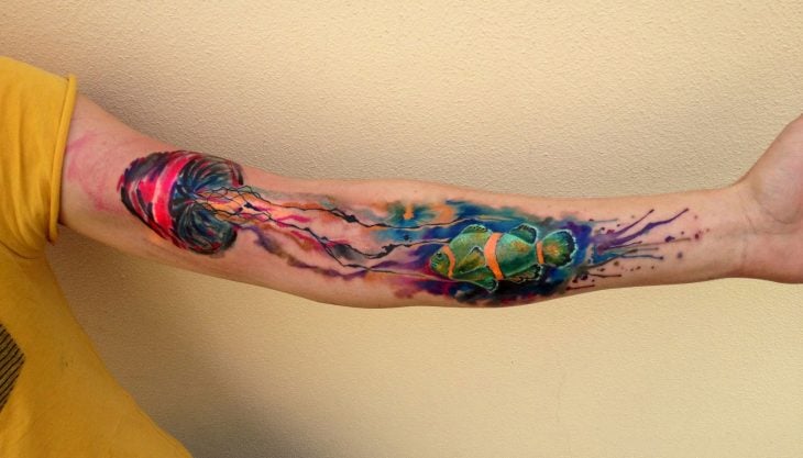 medusa y pez tatuados con la técnica de acuarela 