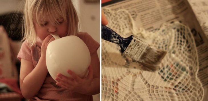 niña inflando un globo y poniendo resistol sobre encaje 