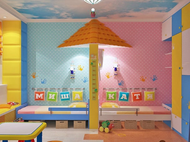 cuarto de niño y niña dividido por una pared en forma de palapa de color rosa y azul 