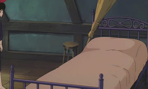gif animación chica cae sobre la cama