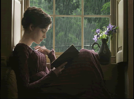 gif chica leyendo frente a ventana con lluvia