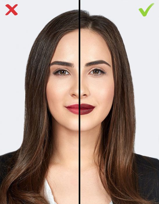 mujer cabello largo y saco negro y labios pintados 