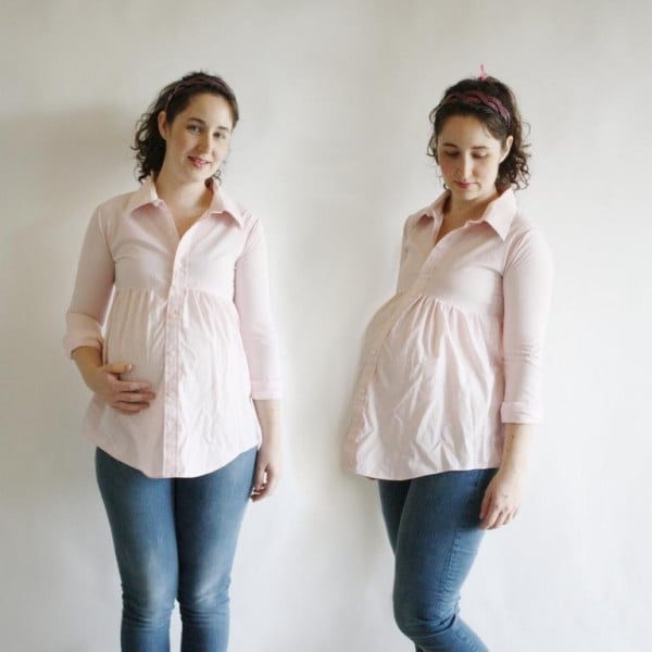 Chica embarazada usando una camisa de hombre modificada 