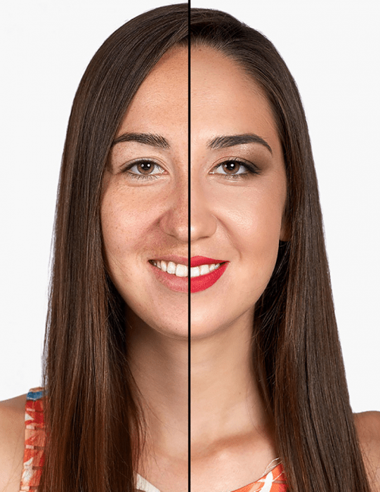 mujer de cabello castaño largo sonrie mitad de su cara maquillada