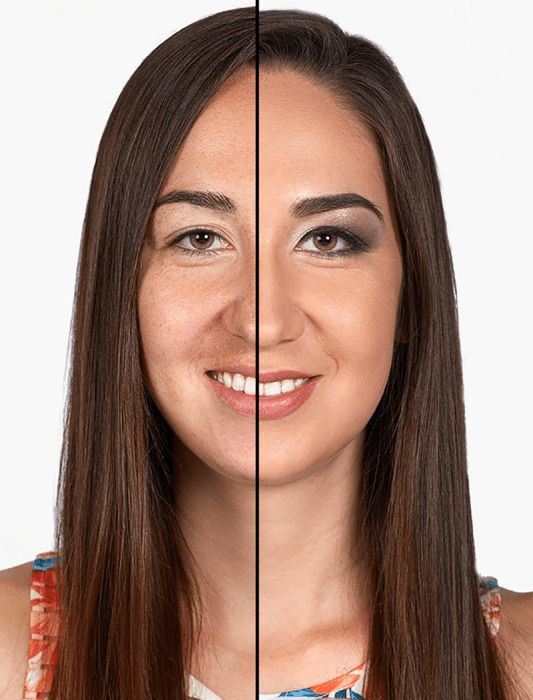 mujer de cabello castaño largo sonrie mitad de su cara maquillada