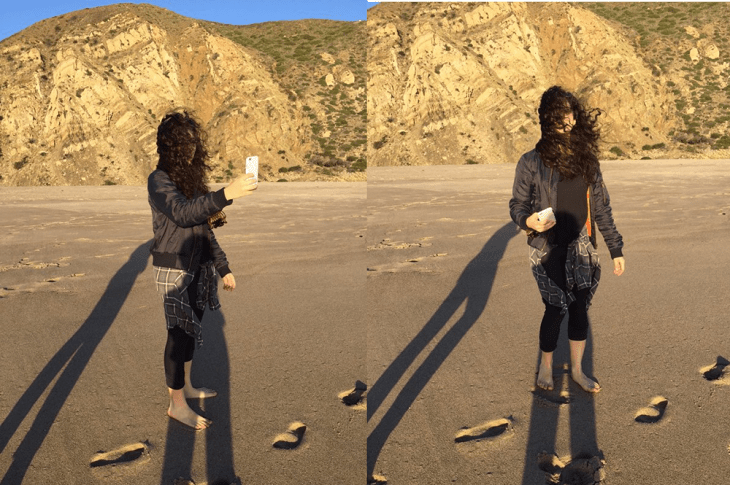 mujer de cabello largo tomándose selfie en montaña 