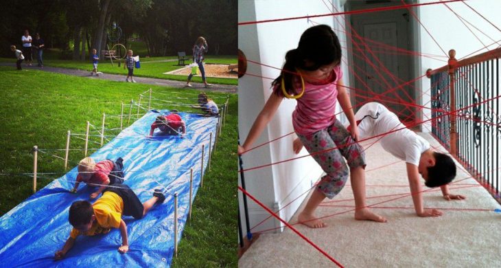 Niños pasando laberintos hechos con estambre. 