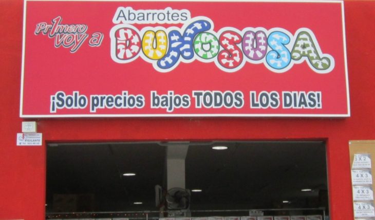 tienda de abarrotes con letrero rojo