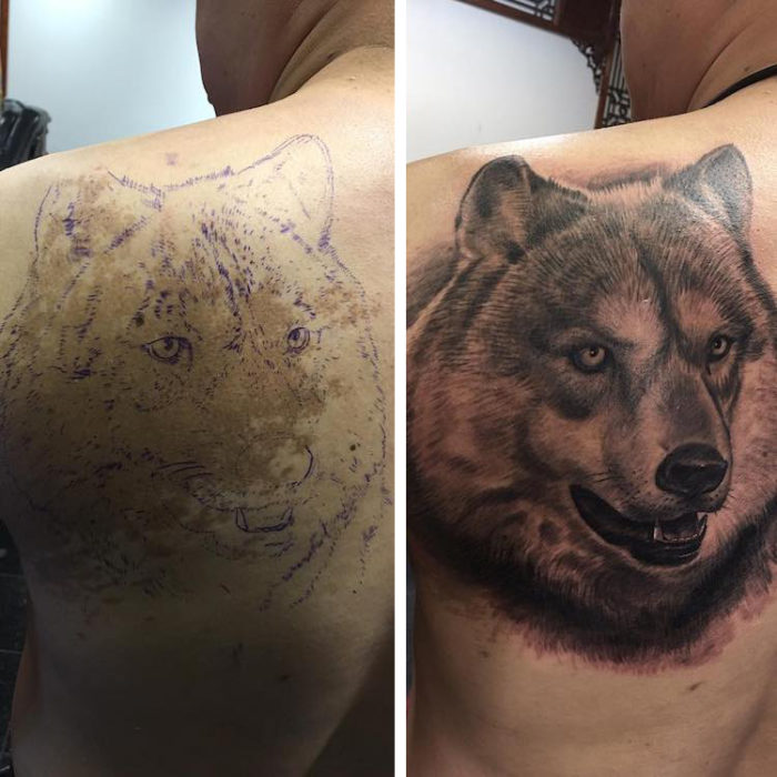 Chico con un tatuaje de lobo en la espalda 