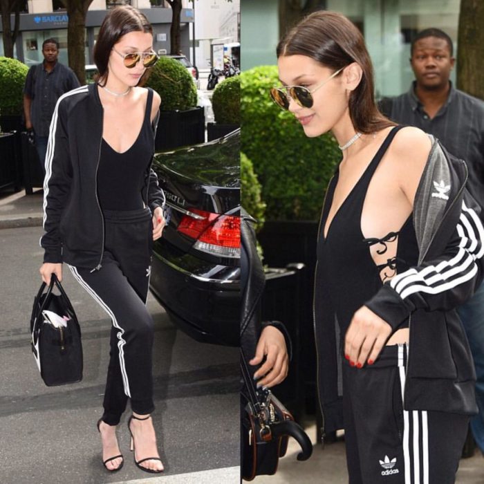 Bella hadid usando unos track pants y un bodysuit