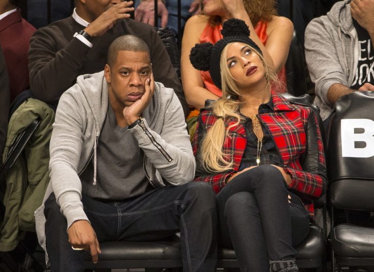 Jay Z and wife Beyonce attend the Brooklyn Nets vs Philadelphia 76ers game with Super Bowl Champion Seattle Seahawks quarterback Russell Wilson