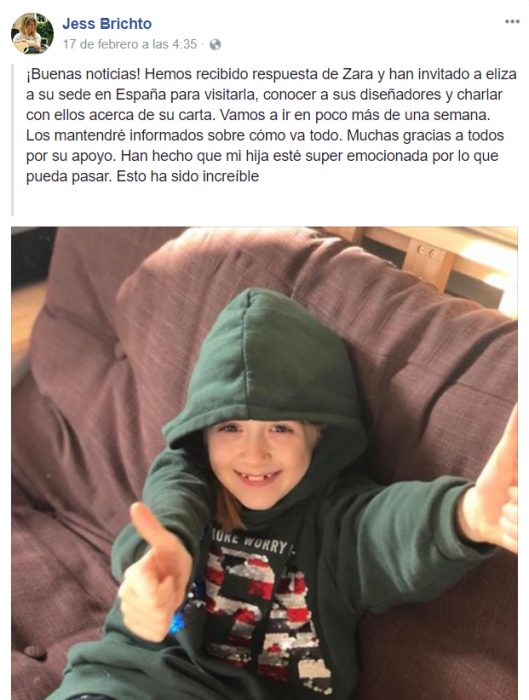 Niña que quiere ser modelo de Zara Boys posando con una sudadera verde 