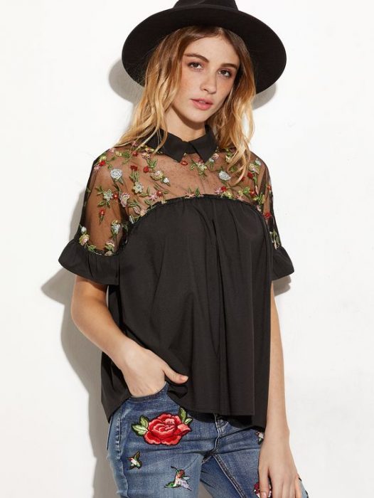 chica usando blusa negra con bordado de flores