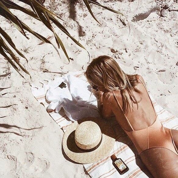 girl on the beach sunbathing