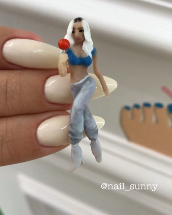 Uñas en 3D Creadas por el salón de belleza nail sunny de paris hilton comiendo paleta