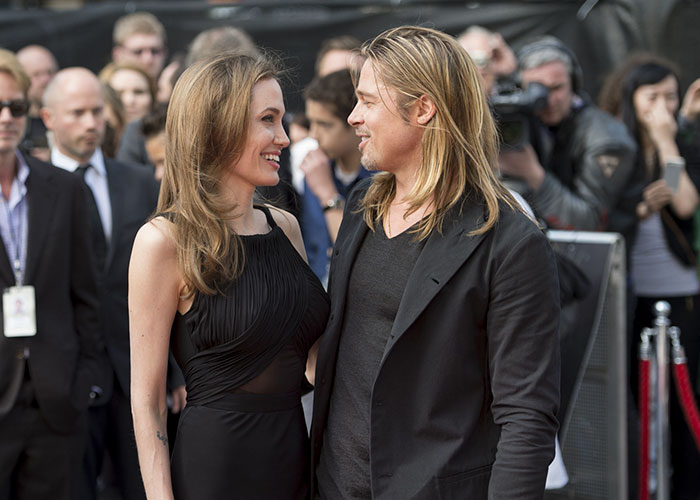 Angelina Jolie y Brad Pitt en una alfombra roja