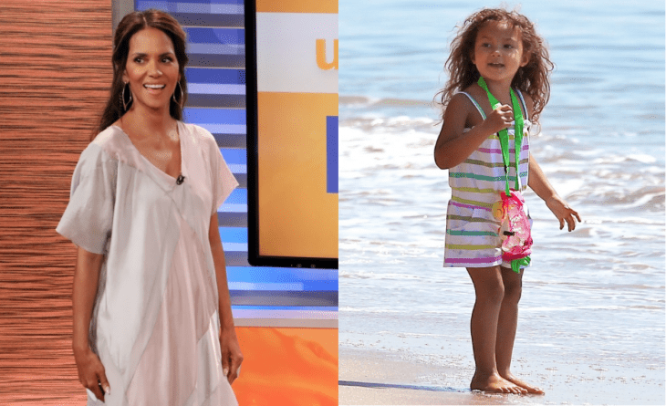 mujer morena junto a niña morena en la playa 