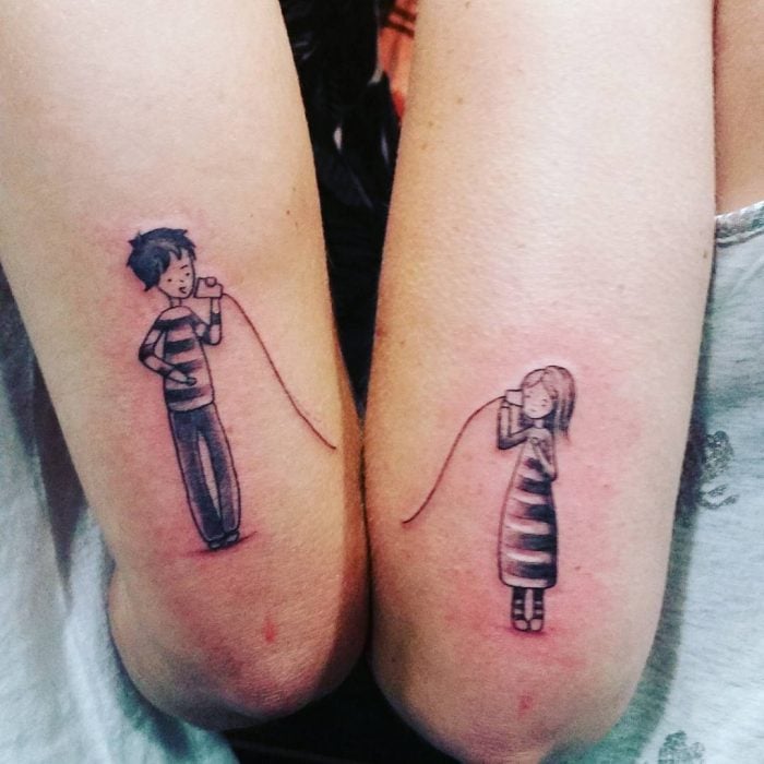 tatuajes de niño junto a niña en el brazo 