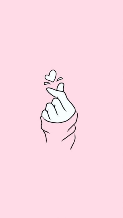 Fondo para celular, wallpaper ilustración de mano haciendo un corazón coreano sobre fondo color rosa