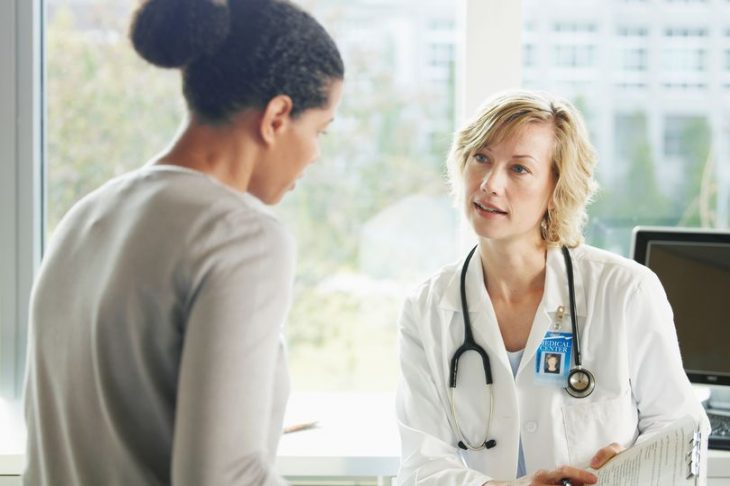 Girl talking to a doctor at her medical appointment