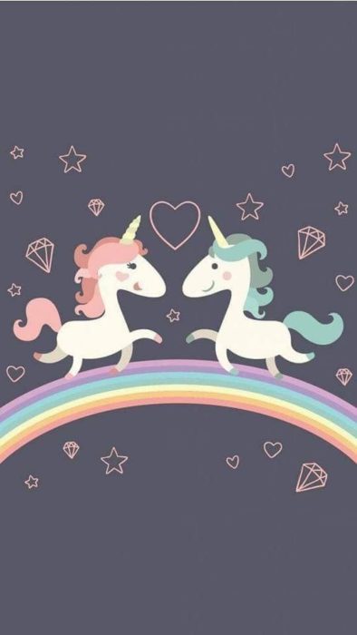 Fondo de pantalla para celular con dibujo de unicornios mirándose de frente sobre un arcoirís 