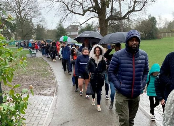 People lining up outside a school to register as bone marrow donors for Oscar Saxelby-Lee