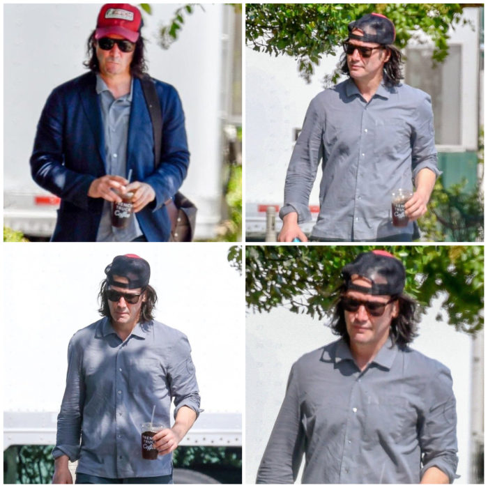 Keanu Reeves caminando por las calles, subriendo su rostro con gafas y gorra