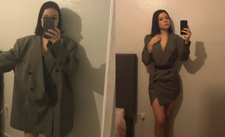 Chica con un saco de hombre modificado como un vestido corto y ceñido al cuerpo 