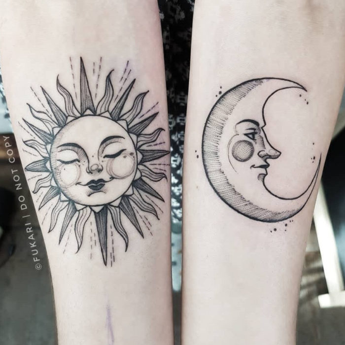 Tatuajes temporales; sol y luna con rostros en el brazo