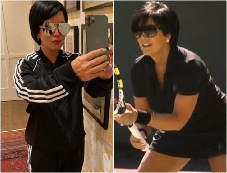 Lily Allen disfrazada como Kris Jenner con ropa deportiva negra, gafas oscuras, cabello corto, tomando una selfie