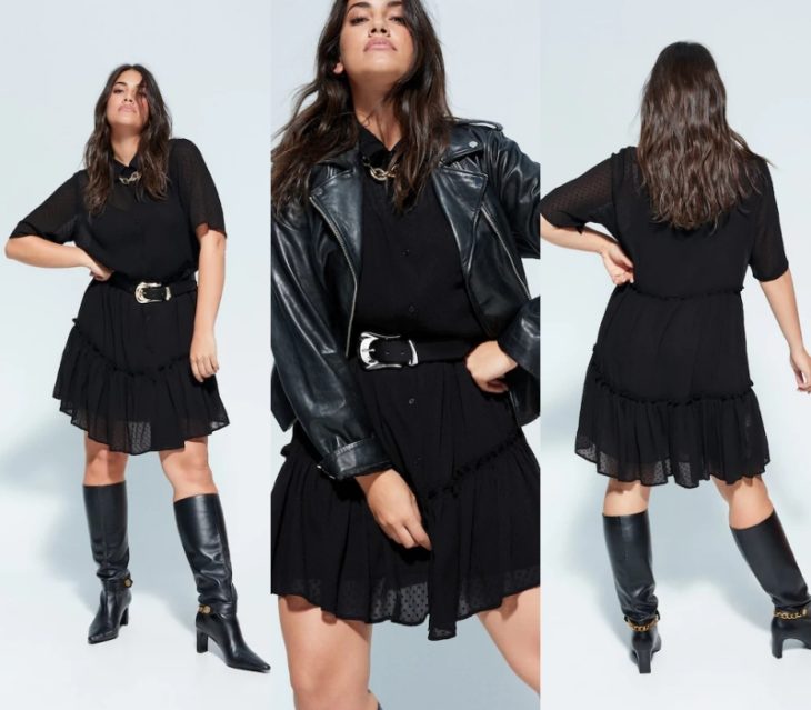 chica curvy de cabello castaño largo usando un vestido negro de gasa, una chaqueta de cuero negra y botas de piel a la rodilla, cinto de piel con hebilla de metal