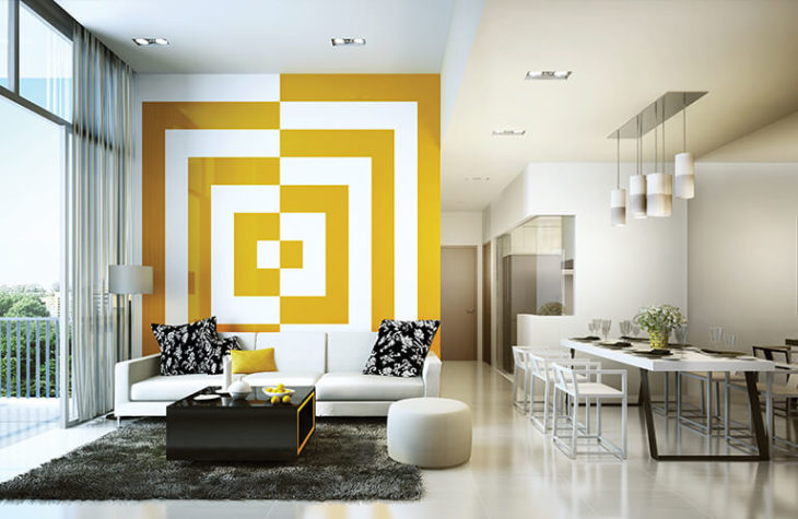 Sala de estar decorada con diferentes patrones y colores en amarillo con blanco