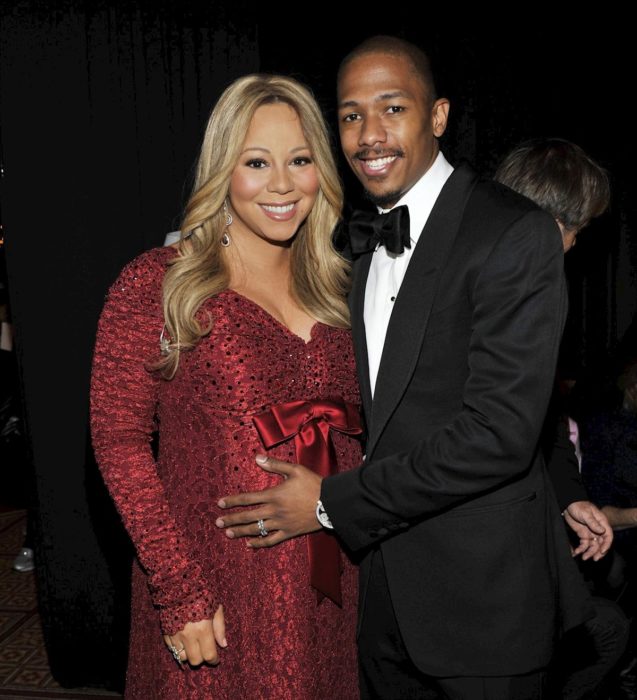 Mariah Carey y Nick Cannon abrazados mientras posan para una fotografía 