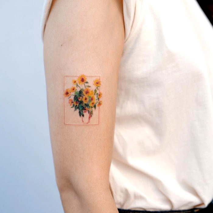 Tatuaje de girasoles en florero en el brazo