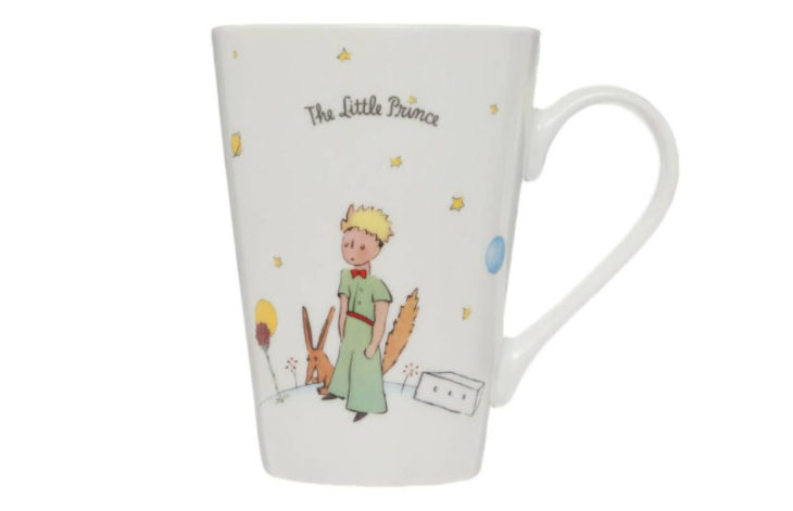 Taza inspirada en El Principito, donde aparece el Principito y el zorro junto con algunas estrellas y una frase