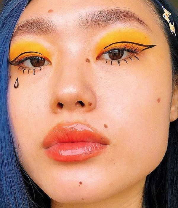 Maquillaje aesthetic en tonos amarillos y negros
