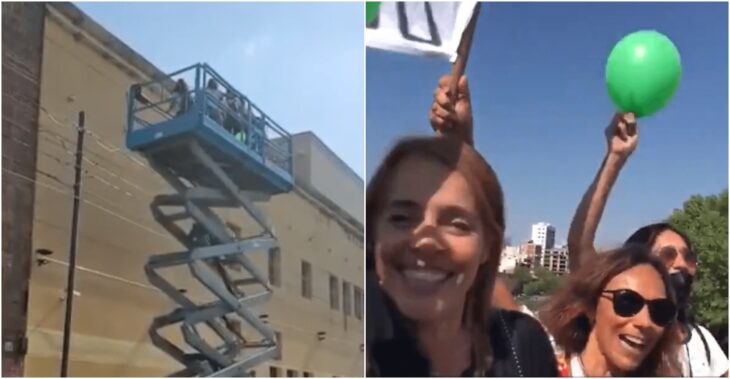 Grupo de mujeres subiendo por una grúa al hospital