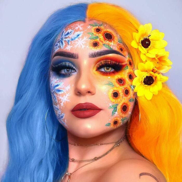 Chica con el rostro pintado con flores y trozos de hielo 