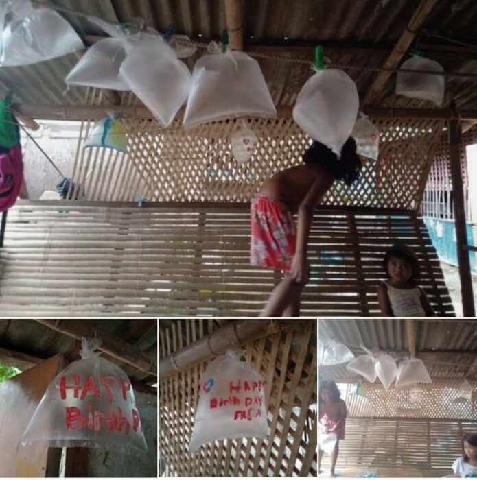 niños decorando una casa con bolsas de plástico como si fueran globos; Niños de bajos recursos usan bolsas de plástico como globos para celebrar el cumpleaños de su papá