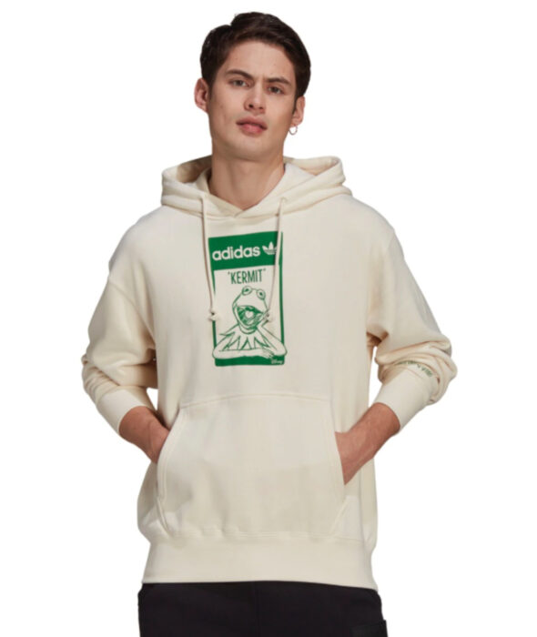 Linea de ropa y calzado de Adidas, Stan Smith Disney; sudadera o hoodie de cuello redondo, con gorro, color hueso y estampado verde de la Rana René