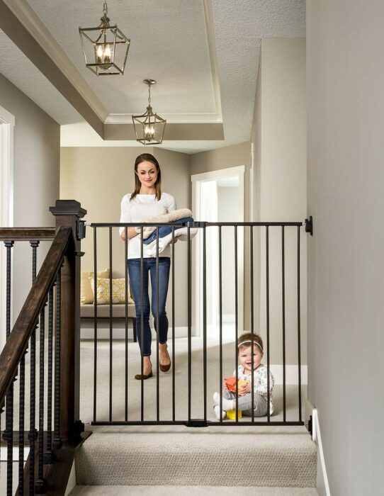 Mom watching her daughter play on the floor 