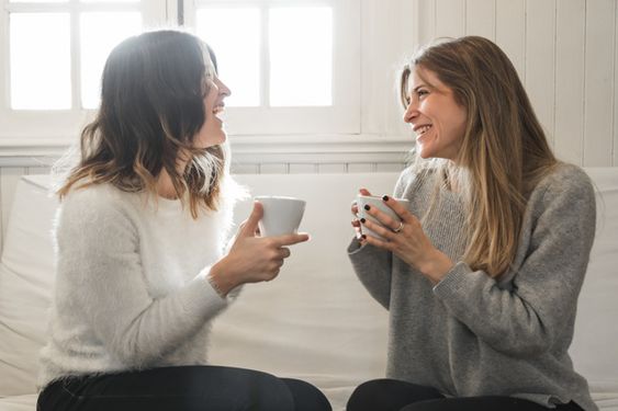 Women chatting while having coffee 