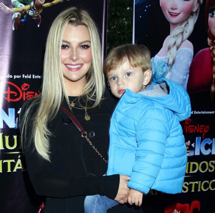 Marjorie de Sousa holding her son in her arms 