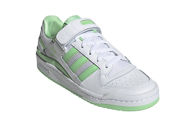 White adidas tennis shoes with green color 