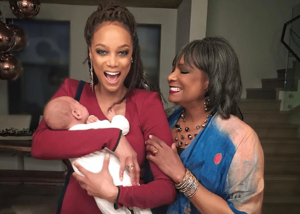 Tyra Bancks posing with her son and mom 