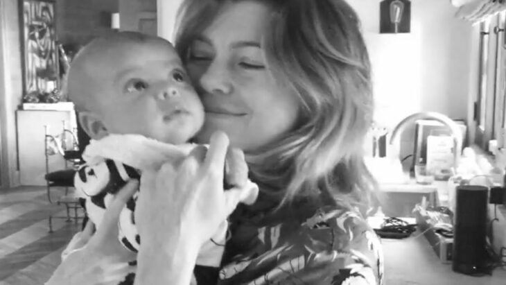 Ellen Pompeo holding her baby in her arms 