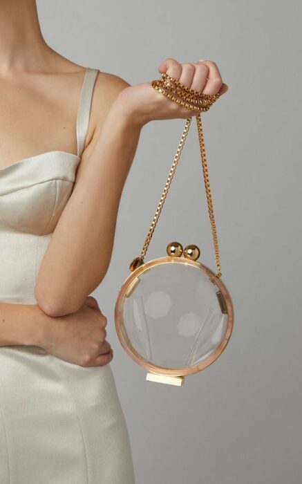 Bolso circular con correa dorada ;Monederos transparentes que vas a querer