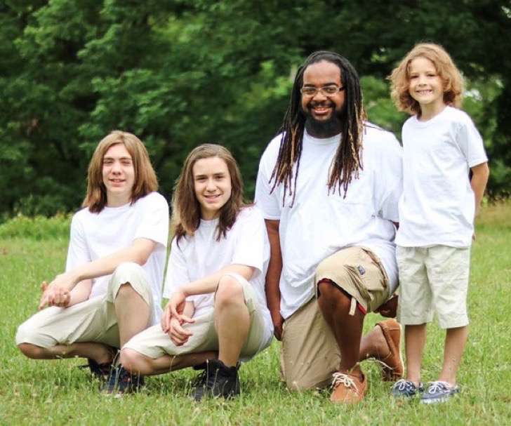 Family taking a selfie in the garden;  Single dad adopts 3 children and proves that all families are perfect